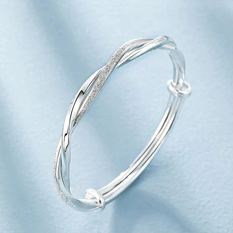 Flätat silverarmband