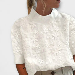 Blus med broderad enkel ståkrage
