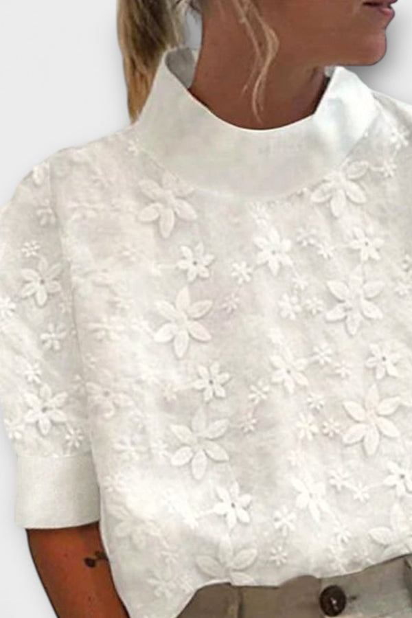 Blus med broderad enkel ståkrage