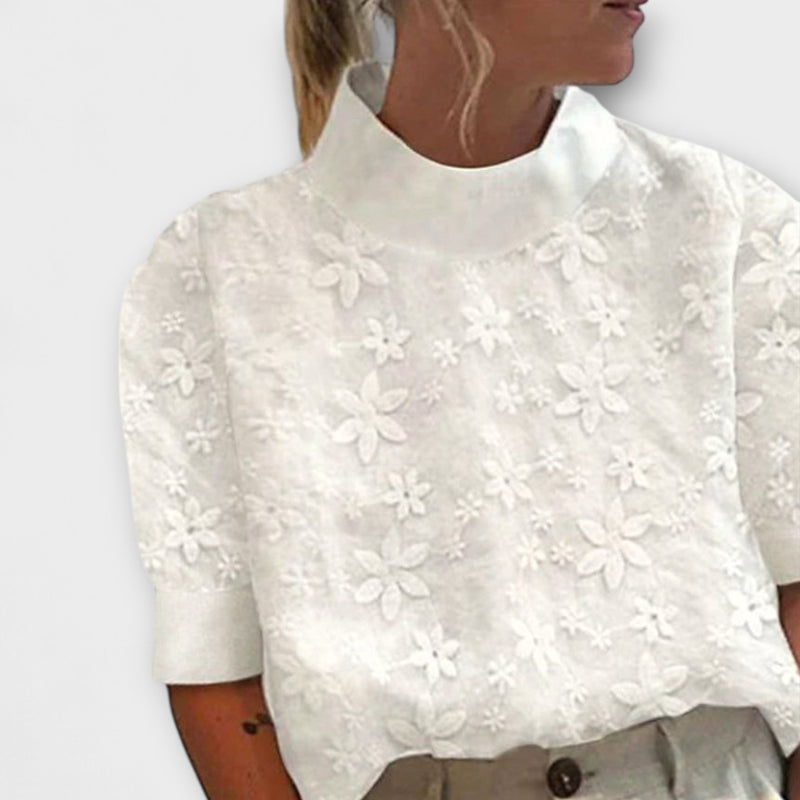 Blus med broderad enkel ståkrage