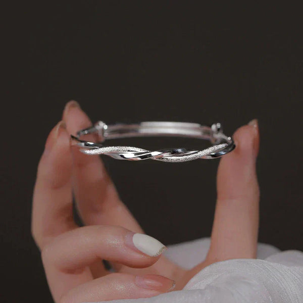 Flätat silverarmband