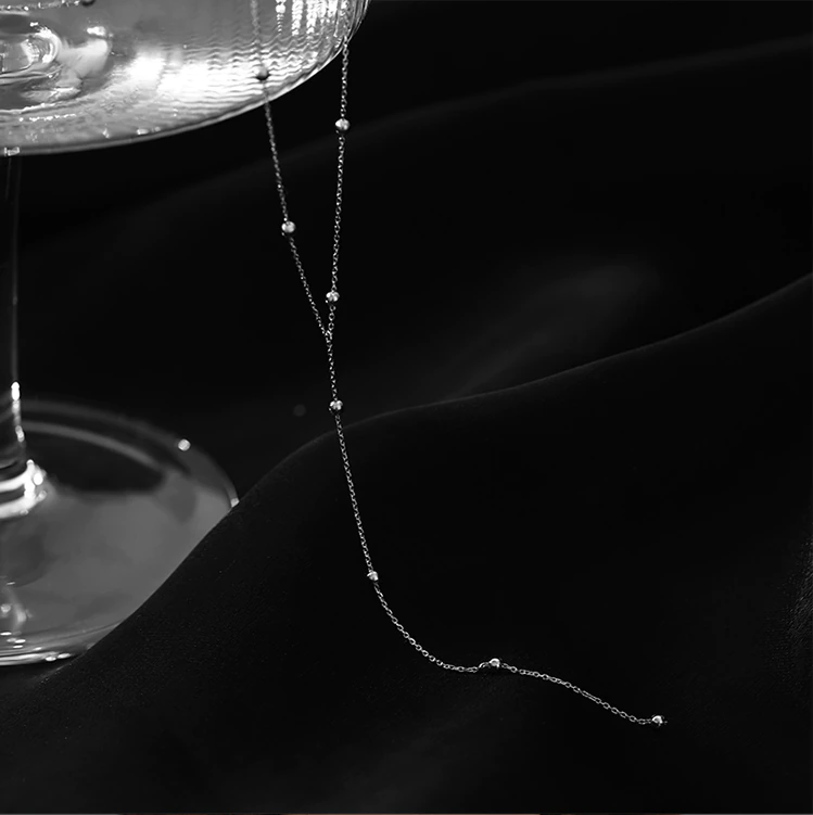 Nyckelben-halsband med fransar