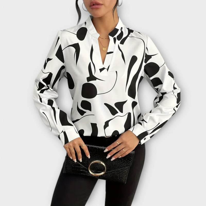 Elegant långärmad blus med spetsig halsringning