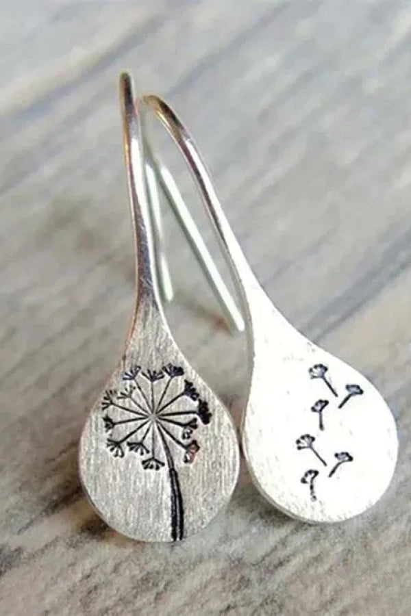 Eleganta silverörhängen i maskrosblad-design