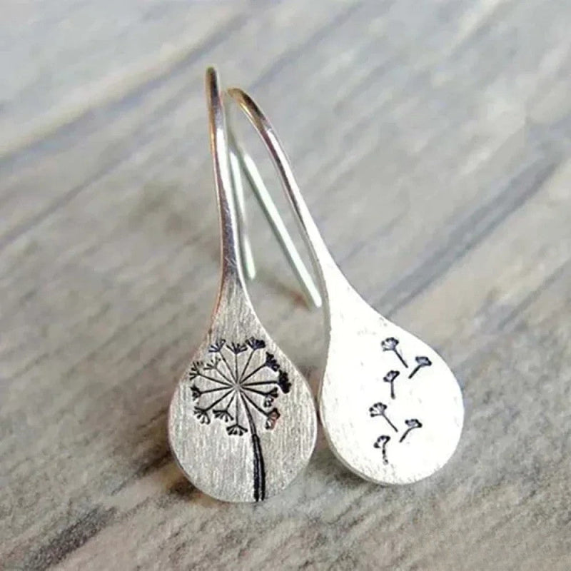 Eleganta silverörhängen i maskrosblad-design